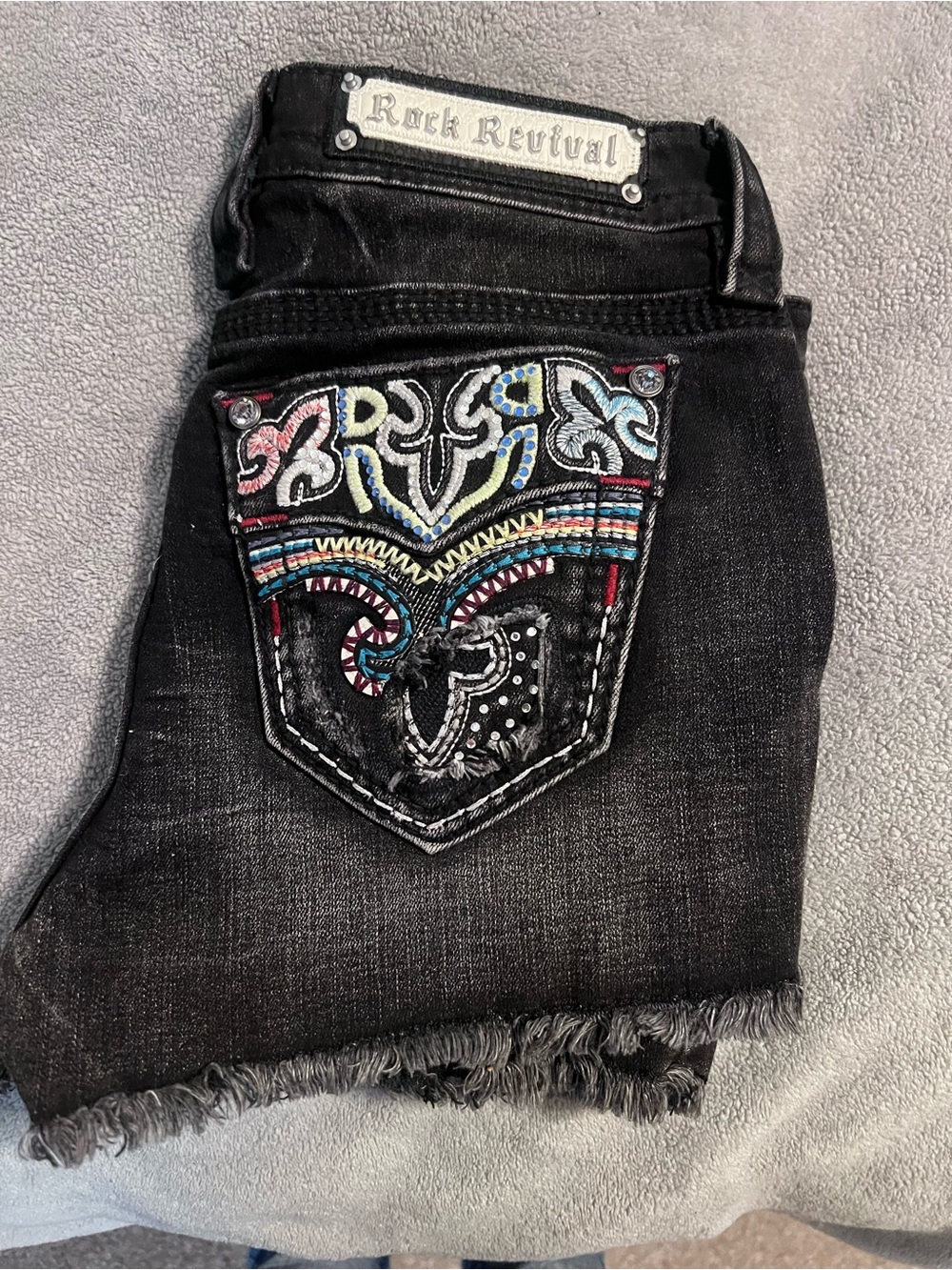 Rock Revival Black Denim Cutoff Shorts with Colorful Embroidered Pocket